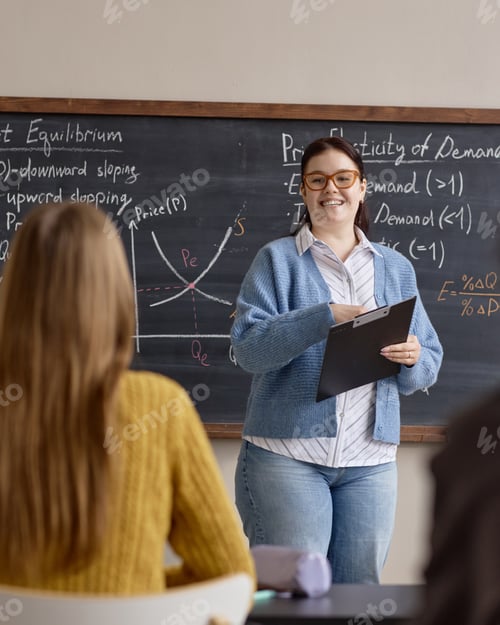 Preview: Vertical of Adult Woman Teacher Explaining Economics Lesson in Classroom