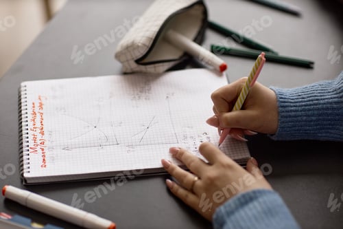Preview: Teenage Girl Writing Math Notes for School Learning and Study