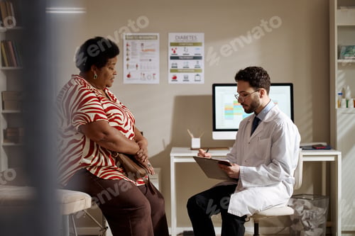 Preview: Black Middle Aged Woman Consulting Doctor About Diabetes Care