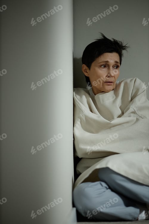 Preview: Middle Aged Woman Sitting in Psychiatric Hospital in Distress