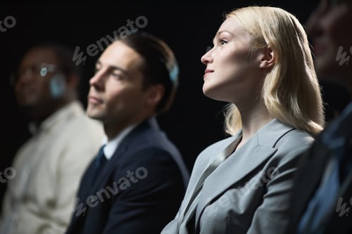 Preview: Businesswoman Attending Corporate Seminar with Diverse Colleagues