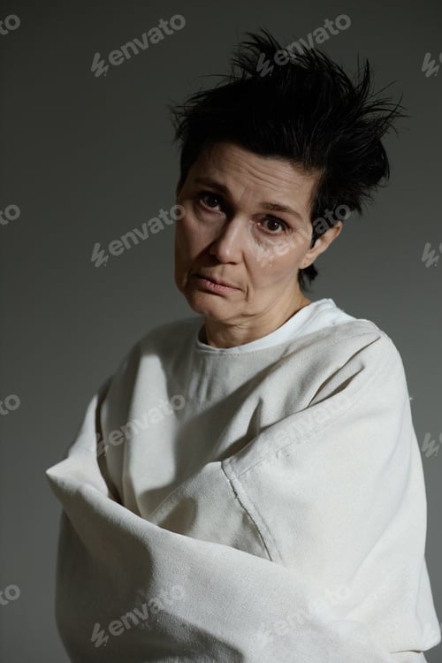 Preview: Portrait of Middle Aged Woman in Psychiatric Care Looking at Camera