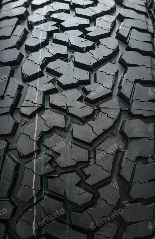 Preview: Black tire tread texture background with detailed rubber pattern.