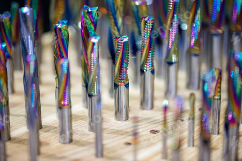 Preview: Colorful carbide milling cutters in wooden holder.