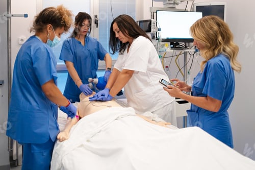Preview: Medical students practicing cpr and resuscitation techniques on dummy