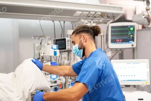Preview: Nurse working in intensive care unit with patient