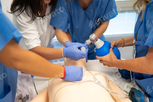 Preview: Medical team practicing cpr and intubation on training dummy