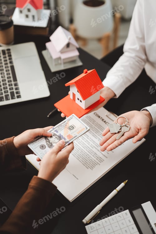 Preview: Person exchanging money for house keys and a model home, symbolizing a real estate transaction, prop