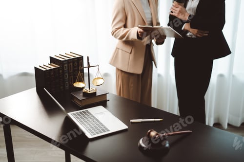 Preview: Legal professionals discussing client case in a modern law office, focusing on justice, law enforcem