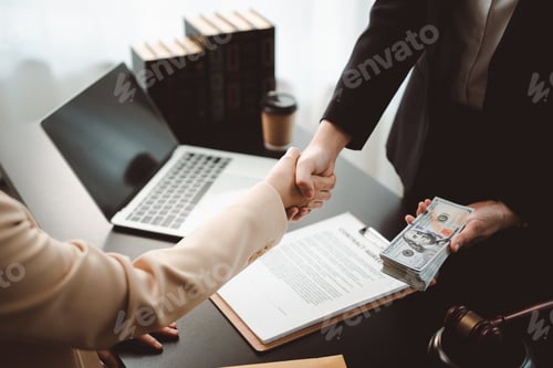 Preview: People shaking hands and making a dishonest business deal, exchanging money behind a contract, illeg