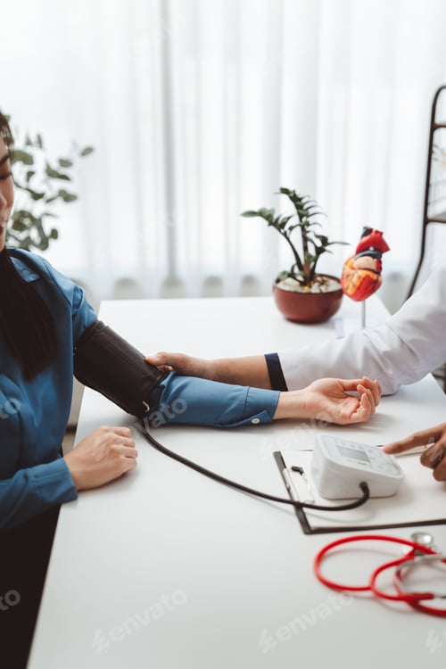 Preview: Doctor measuring woman's blood pressure, promoting heart health awareness and cardiovascular disease