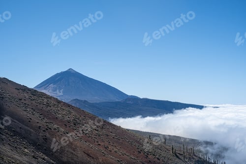 Preview: Mount Teide Rising Above a Sea of Clouds With Volcanic Slopes on Tenerife, Canary Islands