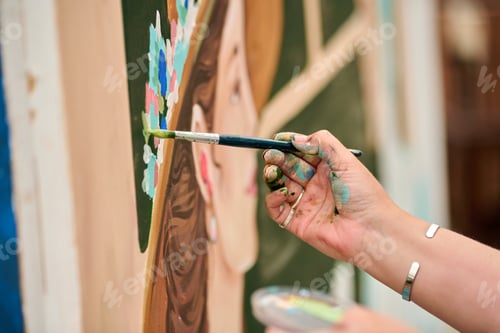 Preview: Close up painting hand applying brush strokes colorful portrait artwork