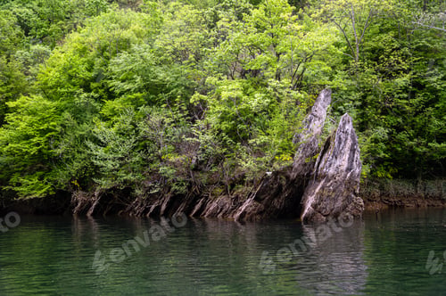 Preview: Canyon view at Matka near Skopje, North Macedonia with green trees and calm water