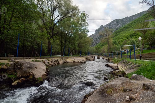 Preview: Canyon view in Matka near Skopje shows flowing water and green trees in North Macedonia.