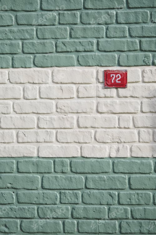 Preview: Brick wall with number plaque on a building
