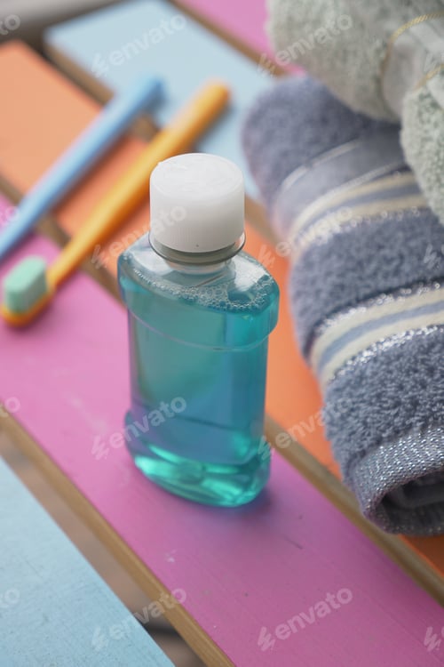 Preview: Mouthwash and dental tools on a colorful surface