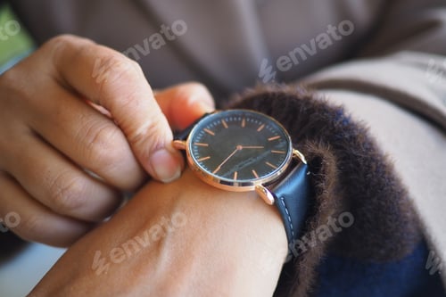 Preview: Checking the time on a wristwatch in the afternoon