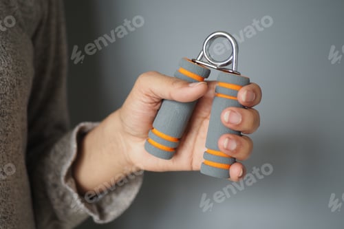 Preview: Hand grip trainer being held by a person