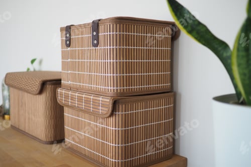 Preview: Storage baskets sit on a wooden shelf at home