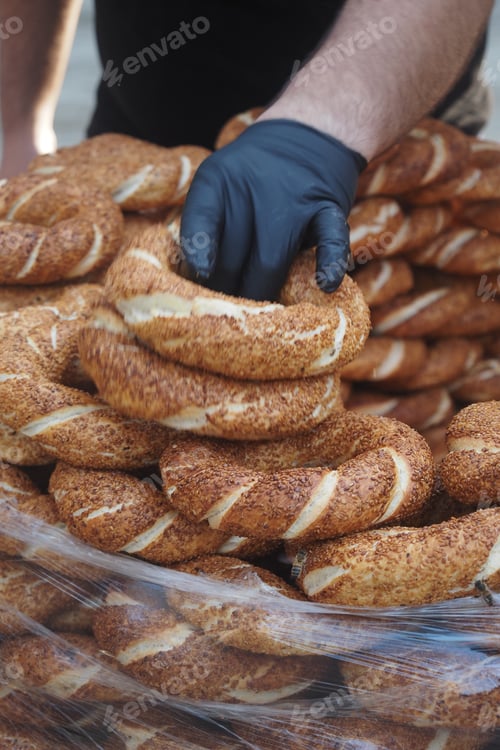 Preview: Baker arranging simit in a market stall in the morning