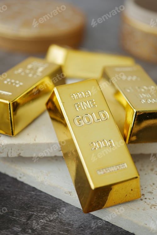 Preview: Gold bars arranged on a table with a wooden surface