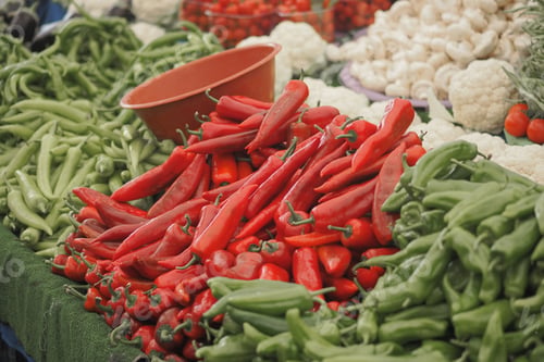 Preview: Market scene with red and green peppers for sale