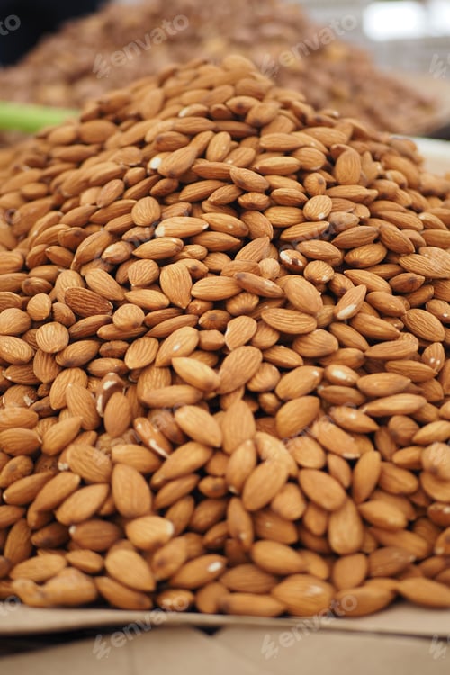 Preview: Almonds stacked in a market for sale in the afternoon
