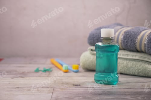 Preview: Mint mouthwash, towels, and toothbrushes on counter