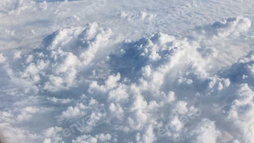 Preview: View of clouds from an airplane flying at a high altitude