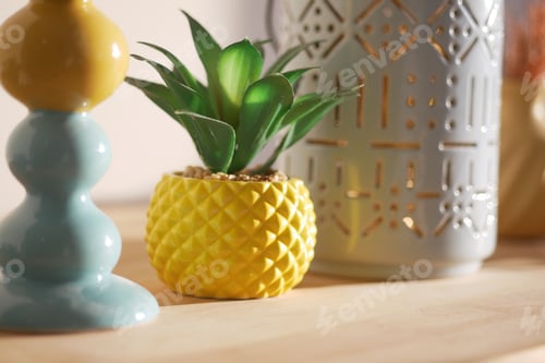 Preview: Decorative items on a wooden table with plants and candles