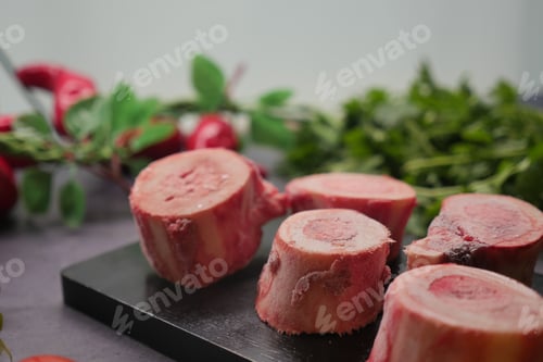 Preview: Fresh bones ready for cooking on a black cutting board