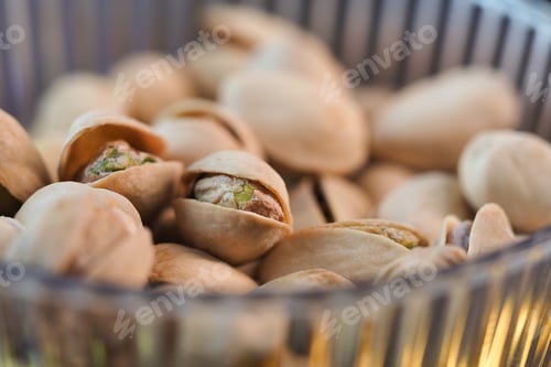 Preview: Pistachios in a clear bowl on a table