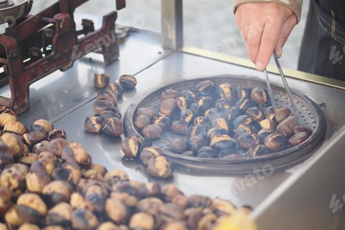 Preview: Chestnuts are roasted on a street cart in the market