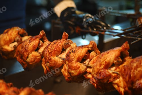 Preview: Grilling chicken on skewers at a street food stall