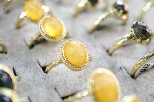 Preview: Shiny rings displayed at a market stall during the day
