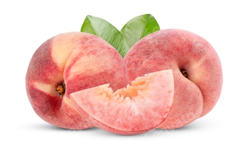 Preview: Two Ripe Flat Peaches and a Slice with Leaves on White Background