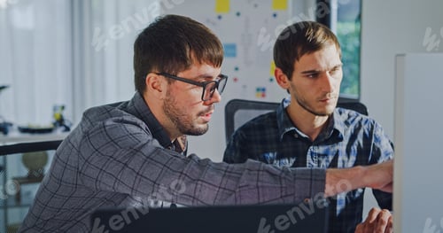 Preview: Team adult male engineer collaborate on robotic hand project using AI code solutions machine learnin
