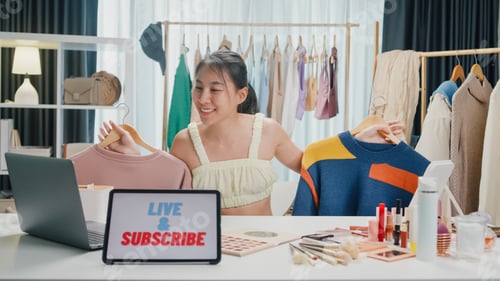 Preview: Young Asia lady seller look at camera live stream use laptop answer follower comment introduce sweat