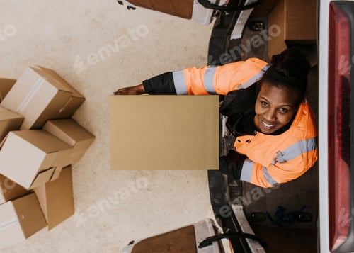 Preview: Woman loading boxes into truck, moving service