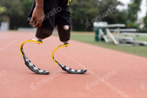 Preview: Athlete with prosthetic legs on a running track