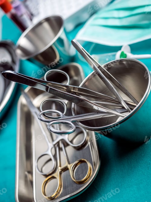 Preview: Some scissors for surgery on a tray in an operating theater, conceptual image