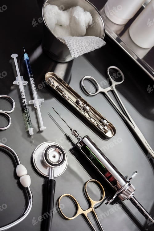Preview: Scissors and Syringes on a Table of Operating Theater of a Hospital Conceptual Image