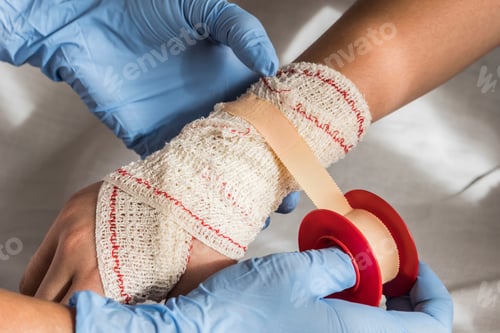 Preview: Close-up Of A Nurse Tying Bandage On Patient's Foot