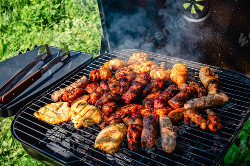 Preview: Grilled Meat Over the Coals on Barbecue