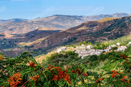 Preview: Picturesque view of a village located on a mountainside in the Sierra Nevada region of Spain