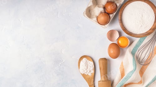 Preview: Ingredients for baking - flour, wooden spoon, eggs.