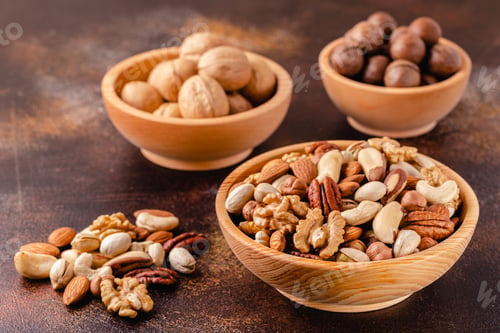 Preview: Various Nuts in wooden bowl.