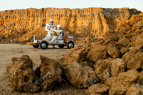 Preview: Exploration on Mars with astronauts driving a rover near rocky terrain at sunset