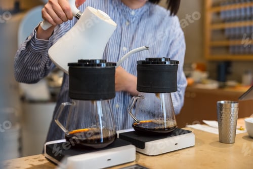 Preview: Cafe worker preparing coffee drink
